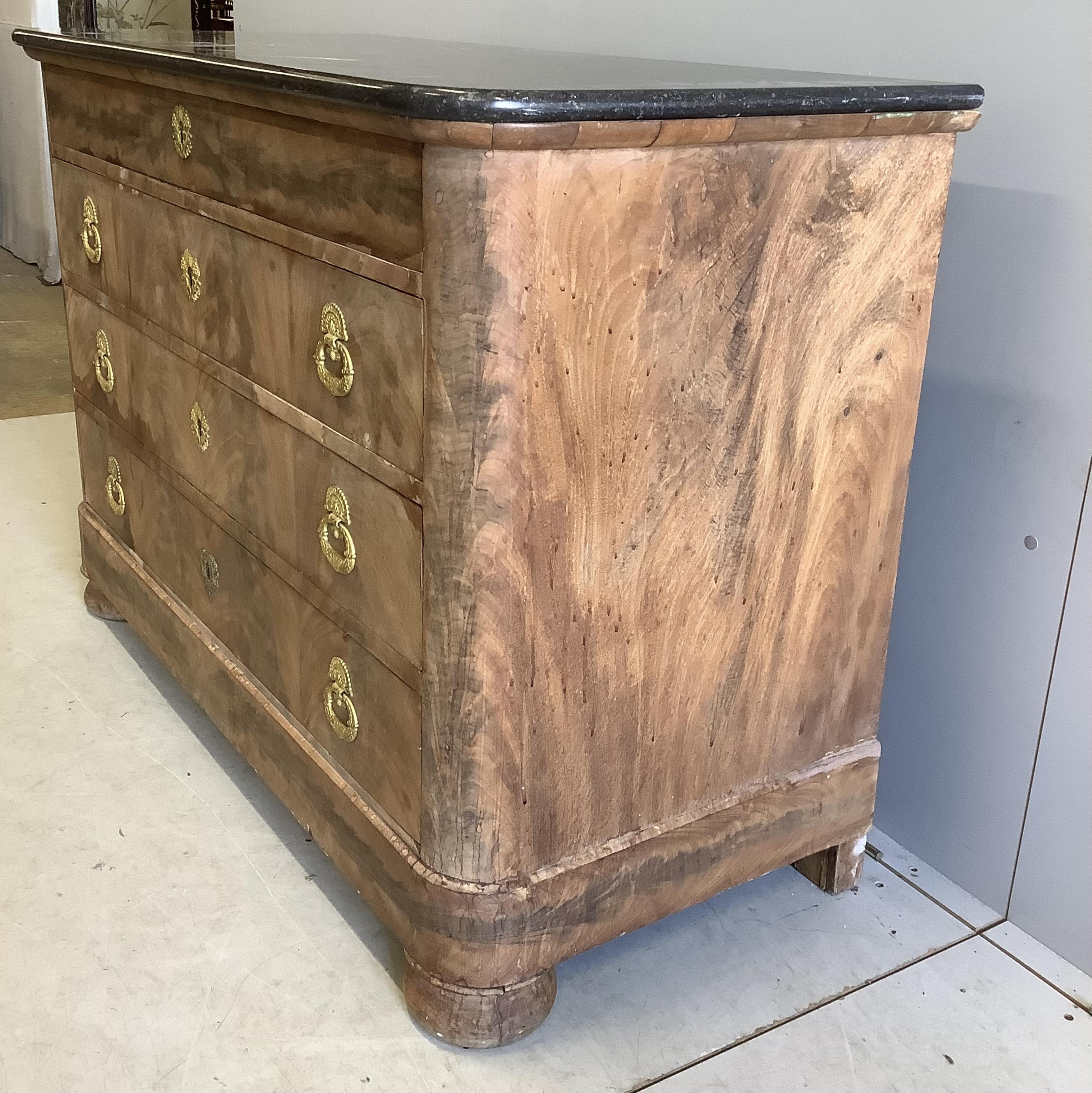 A 19th century French faded mahogany marble topped four drawer commode, width 130cm, depth 59cm, height 92cm. Condition - fair